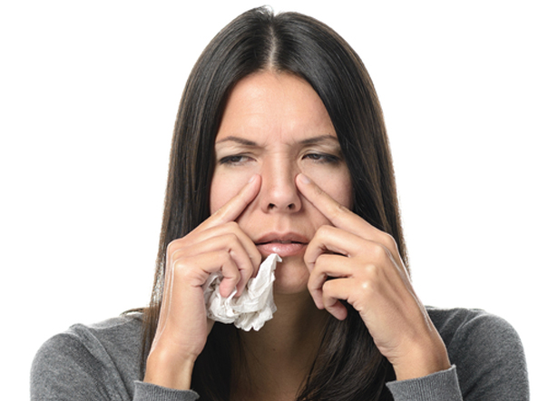 Woman experiencing sinus congestion